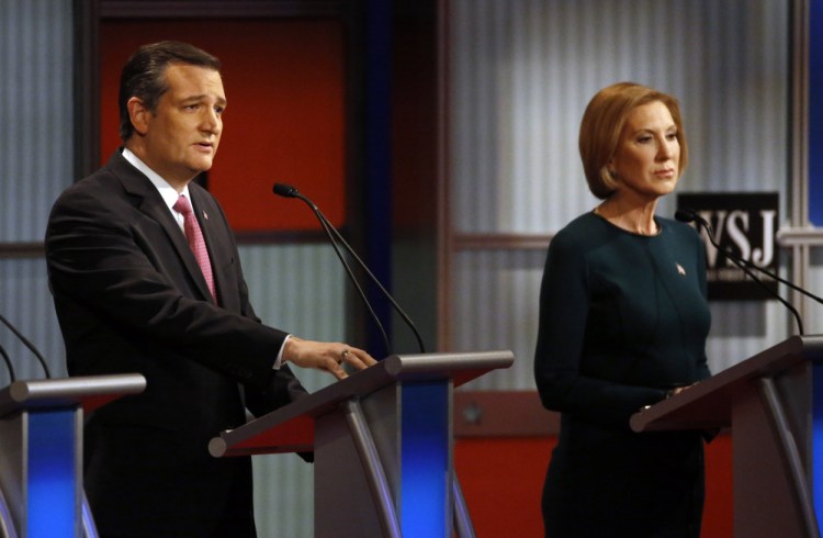 Ted Cruz speaks as Carly Fiorina listens during debate in Milwaukee in November.
The Associated Press