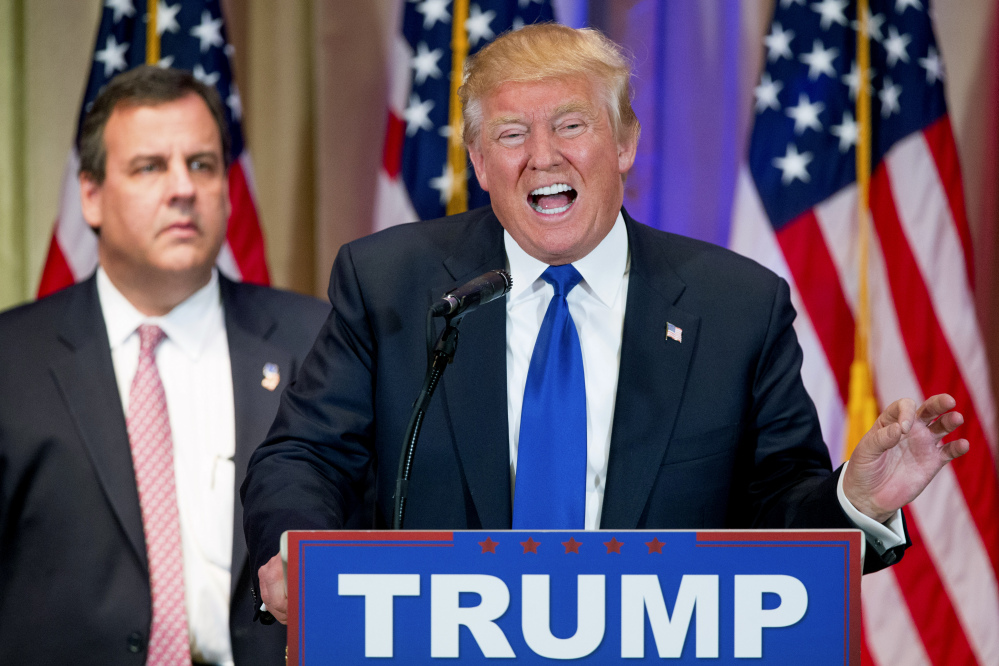 Republican presidential candidate Donald Trump, accompanied by New Jersey Gov. Chris Christie, speaks during a news conference on Super Tuesday primary election night at The Mar-A-Lago Club in Palm Beach, Fla.