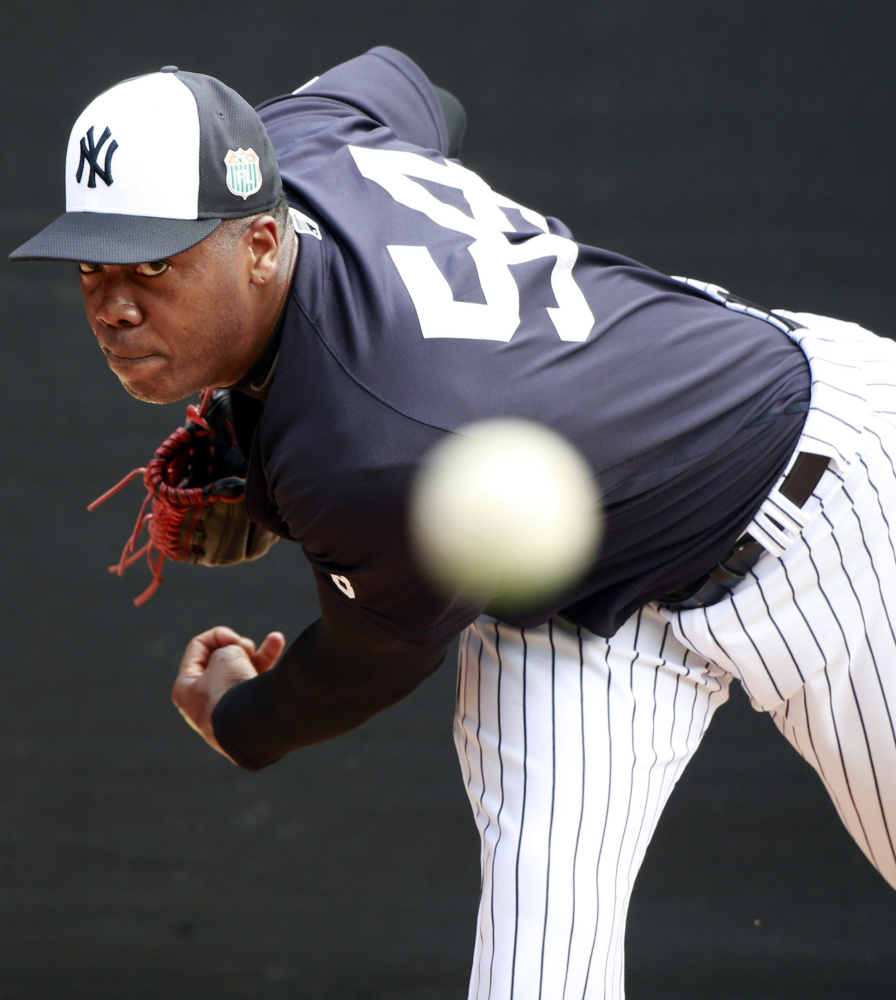 Aroldis Chapman, accused of choking his girlfriend and firing a gun in his garage, won’t be available to the New York Yankees for 30 games.