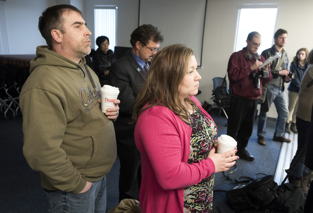 Greg Hale, a cousin of Joyce McLain, along with his wife, Heather, listen as Maine State Police Col. Robert Williams briefs the media on the arrest of Philip Scott Fournier in connection with the 1980 death of high school student Joyce McLain.
