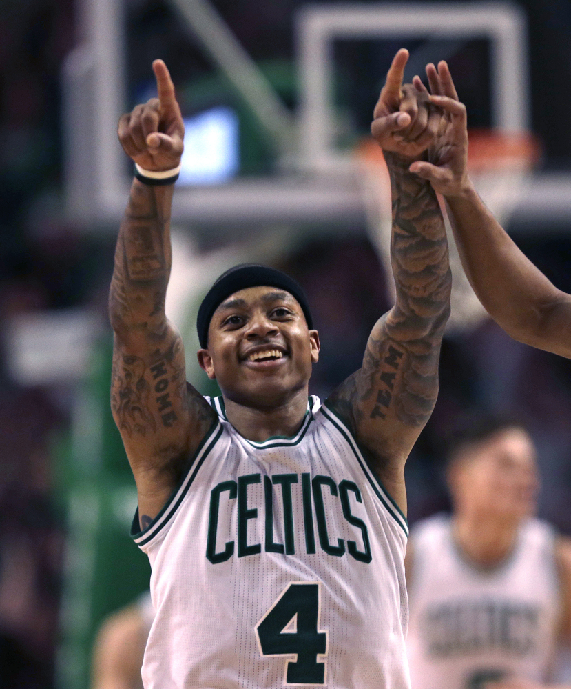 The Associated Press Isaiah Thomas of the Celtics celebrates after hitting a 3-point shot in the second half Wednesday night in Boston.