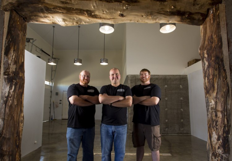 From left, Alex Anastasoff, John LeGassey and T.J. Hansen, who opened South Portland’s Fore River Brewing Co. in January, are eager to hear the wisdom of Dick Cantwell at the beer summit. “We’ll eat it right up,” LeGassey said.