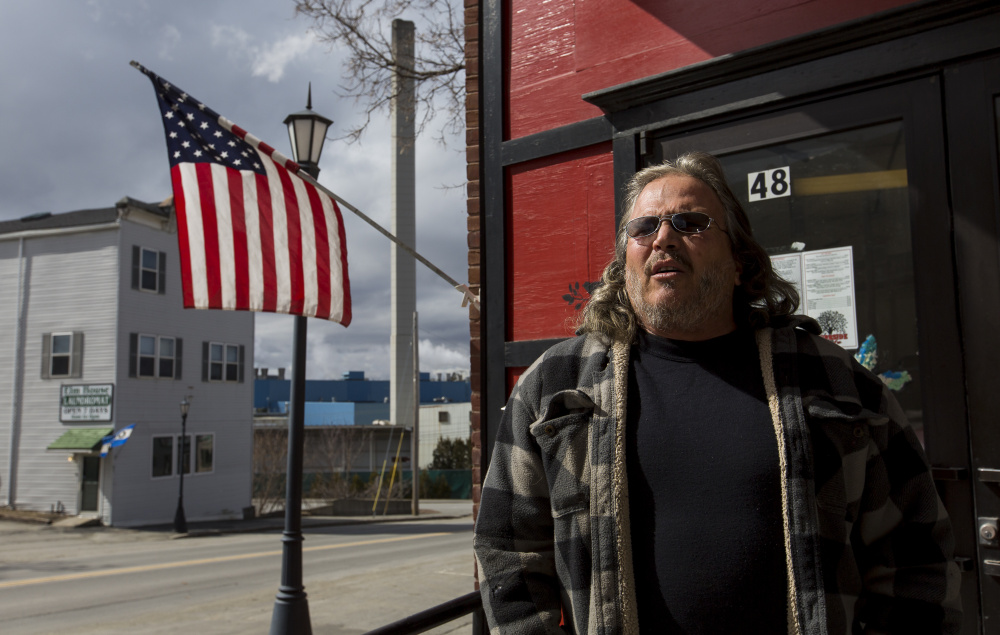 Larry Boiardi, 48, of North Anson, stands outside the Curbside Cafe, across the street from Madison Paper Industries. Boiardi, whose wife owns the cafe, said he’s motivated to vote in a presidential election for the first time in decades. National security and economic hardships have turned Boiardi into a staunch supporter of Republican presidential candidate Donald Trump. 