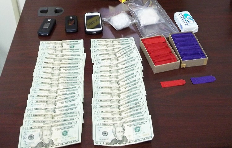 A stash of drugs and cash found by the The Maine Drug Enforcement Agency after the arrest of two men from Connecticut and New York in Houlton. Photo Courtesy of the Maine Drug Enforcement Agency