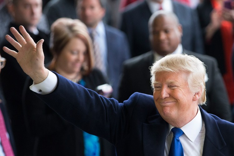 Donald Trump waves to supporters at a campaign stop at the Port-Columbus International Airport in Columbus, Ohio, on Tuesday. In recent days, the New York businessman easily fended off a frantic, last-minute push from Republican Party stalwarts like 2012 presidential nominee Mitt Romney to thwart his success.
