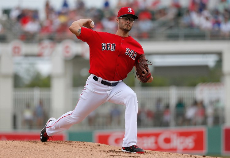 Joe Kelly works against the New York Mets in the first inning of Thursday's game in Fort Myers, Fla. Kelly  allowed just one run on five hits in seven innings.
The Associated Press