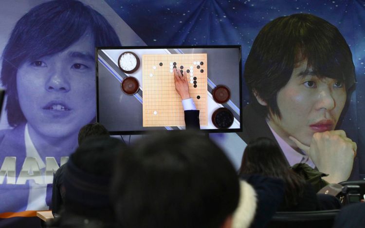 Go fans watch a live broadcast of the Google DeepMind Challenge Match at Korea Baduk Association office in Seoul, South Korea, Wednesday. The Associated Press