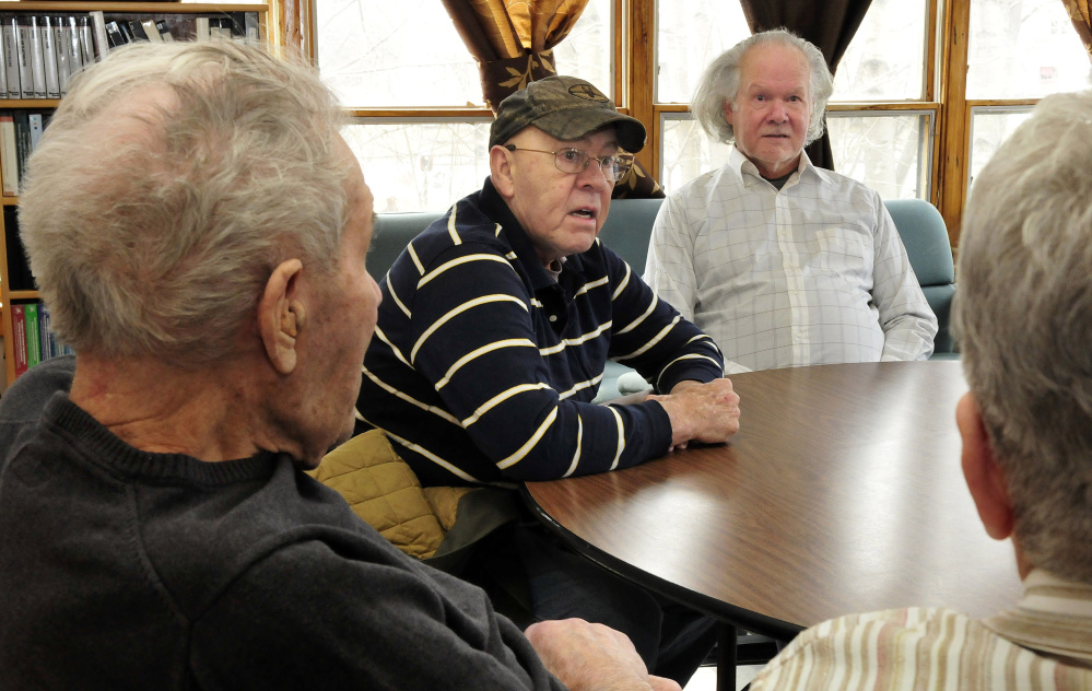 Beecher Ladd, left, listens as his sons Phil, center, and Wayne and daughter-in-law Marilyn talk about Beecher Ladd's 77-year marriage to his late wife, Ginny.