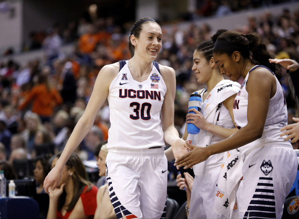 Connecticut's Breanna Stewart (30) comes out of the game late in the second half of a national semifinal game against Oregon State at the women's Final Four on Sunday in Indianapolis. Connecticut won 80-51.