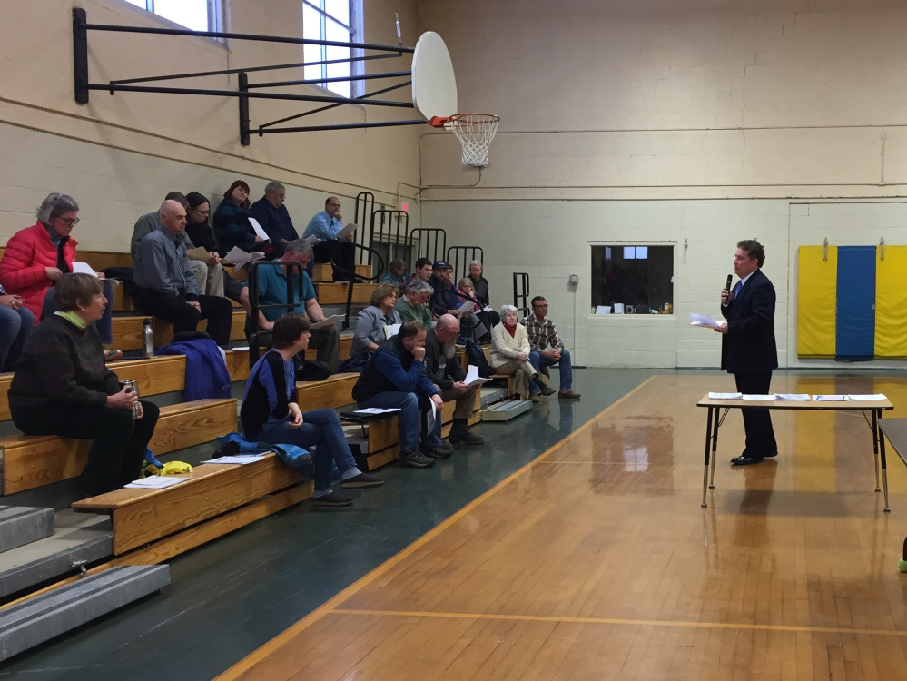 RSU 9 Superintendent Tom Ward addresses a gathering of some 30 people at an informational meeting on the school budget at Academy Hill School on Monday.