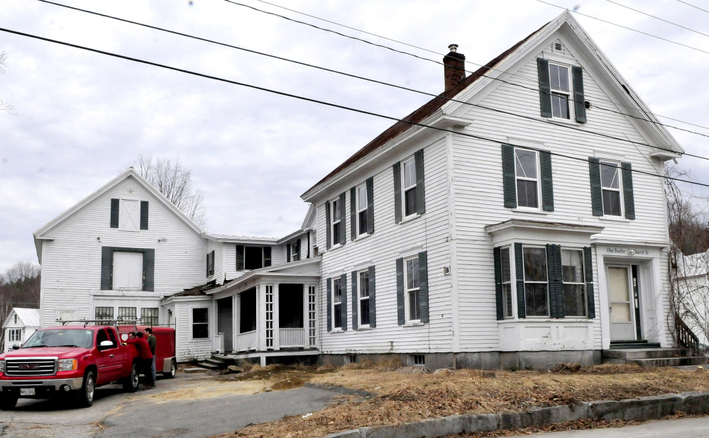 The apartment house at 112 Church St. in Farmington will be torn down and replaced with a municipal parking lot.