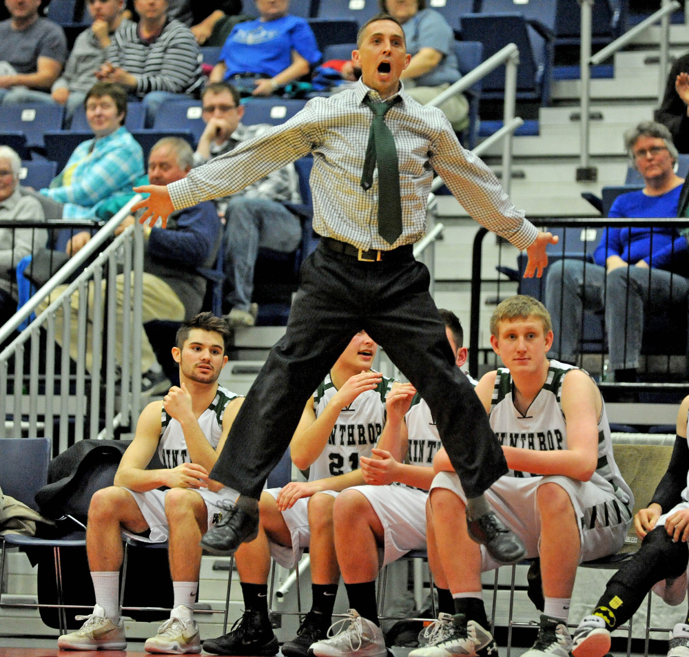 Winthrop boys basketball coach Todd MacArthur jumps and waves his arms and legs to motivate his team during the Class C South championship game against Waynflete last season. MacArthur is the Kennebec Journal Boys Basketball Coach of the Year.