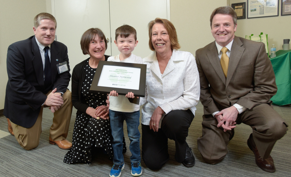 Hunter Norwood, 5, of Manchester, was presented a 2016 eco-Excellence Award March 23 during a 2016 ecomaine eco-Excellence Awards in Portland. From left, are Jim Gailey, chairman of ecomaine's board of directors and city manager for the City of South Portland; Karen Toothaker of Manchester Elementary School; Hunter Norwood, Barbara Galouch of Manchester Elementary School, who nominated Hunter for this award; and Kevin Roche, CEO of ecomaine.