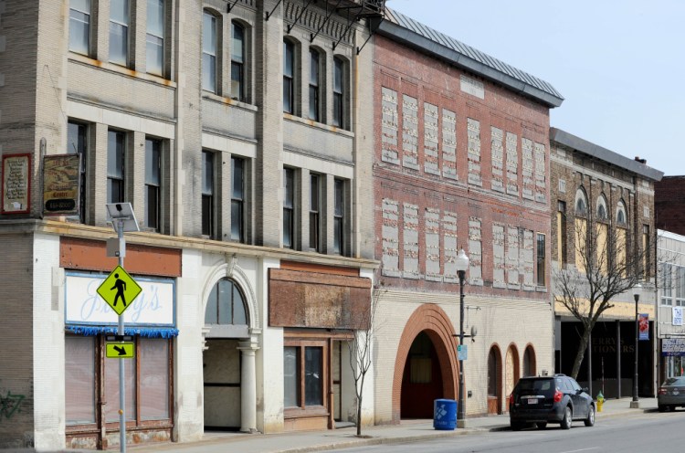 The Hains Building, left, and former Atkins Printing buildings are seen Wednesday on Main Street in downtown Waterville.