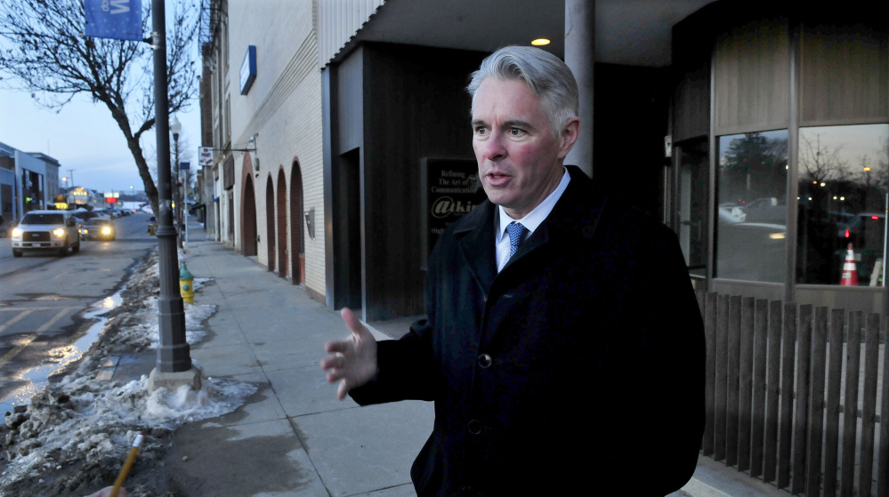 Colby College President David Greene, seen in January on Main Street in downtown Waterville, said this week the college is moving ahead with downtown development plans, including hiring a director of commercial development.