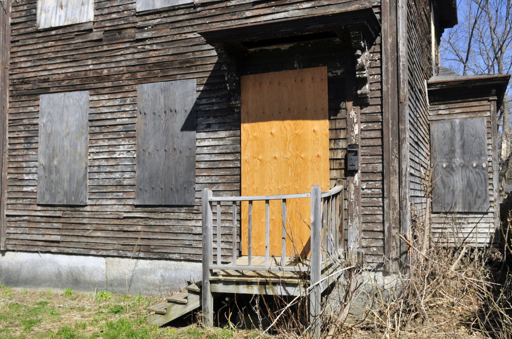 A house at 5 Patterson St. in Augusta, shown Tuesday, would be out of compliance with a proposed property maintenance ordinance, which, among other things, would prohibit boarding up windows.