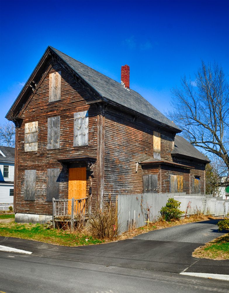 A house at 5 Patterson St. in Augusta, shown Tuesday, would be out of compliance with a proposed property maintenance ordinance, which, among other things, would prohibit boarding up windows.