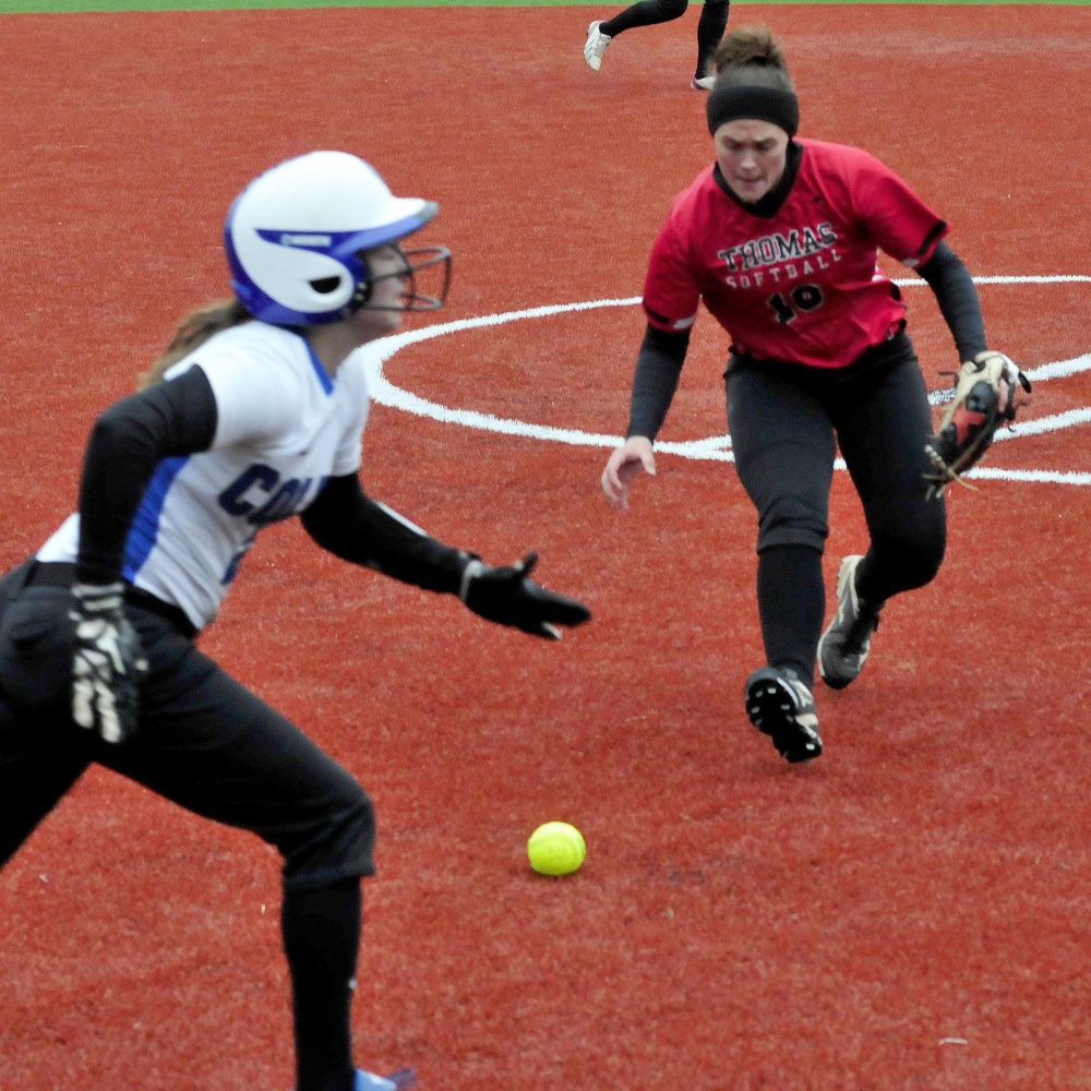 Thomas College pitcher Sonja Morse fields a bunt by Colby College player Katie McLaughlin and makes the out during a game on Monday in Waterville.