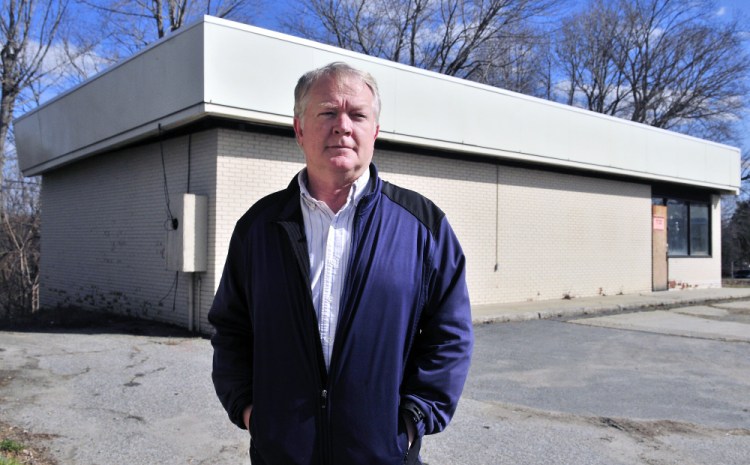 Kevin McCarthy, vice president of Copy Center Plus, stands in front of at 179 State St. in Augusta, which he plans to turn in to a copy center.