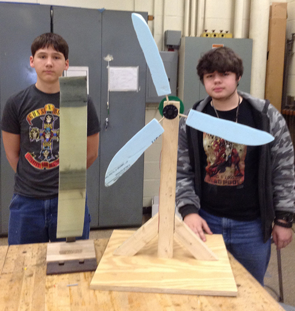 The Winslow team of Ross Hughes, left, Micah Dickson placed first, earning them the chance to compete at the National Kid Wind Challenge, to be held at the American Wind Energy Association's Windpower Conference this May in New Orleans. Micah and Ross had designed blades from insulating foam board and a gear train for power generation. They also created a presentation to document their design process and knowledge of wind power.