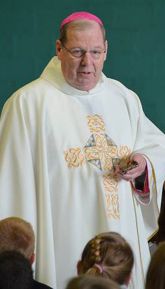 Bishop Robert P. Deeley conducts morning Mass April 13 in the gym at Mount Merici Academy in Waterville.
