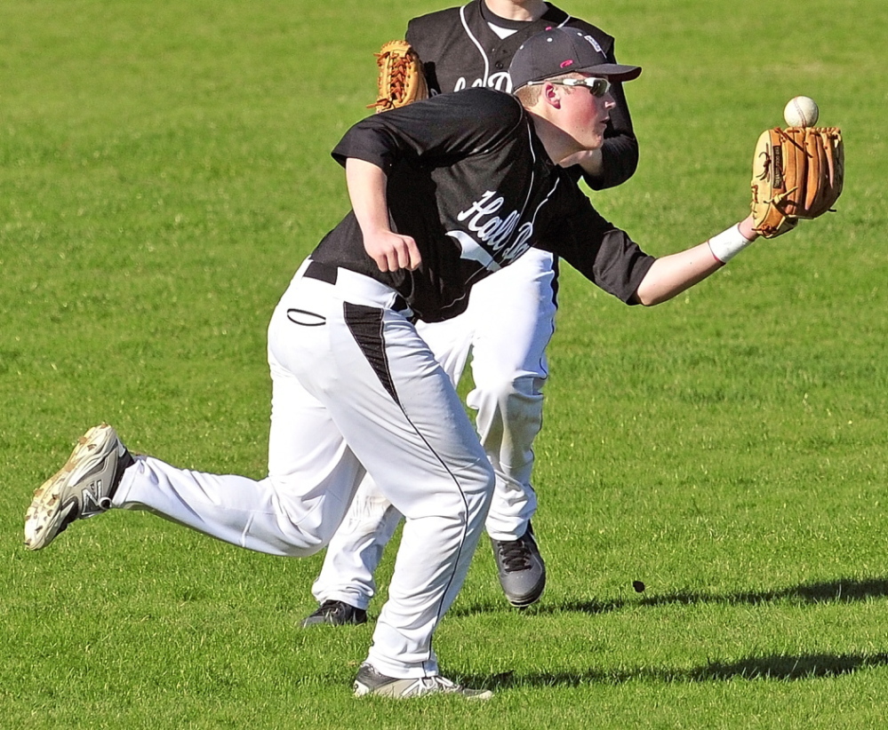 Hall-Dale shortstop Ryan Sinclair fields a ball during a 2014 game at Hall-Dale High School in Farmingdale. Sinclair, a senior, missed his junior season due to a broken kneecap.