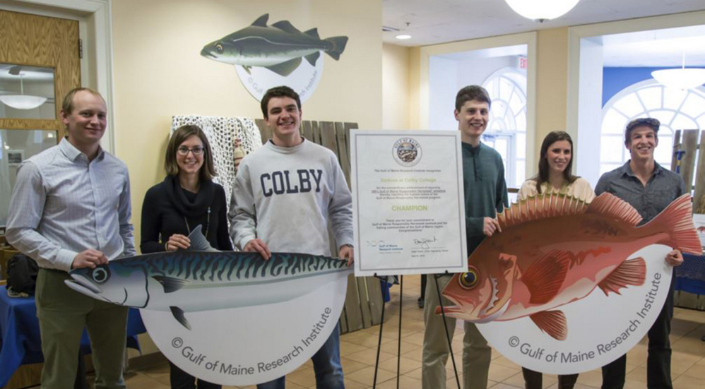 The Gulf of Maine Research Institute, which oversees ocean stewardship and economic growth in the Gulf of Maine region, recognized Colby College in Waterville as the first educational institution to serve 100 percent Gulf of Maine responsibly harvested whitefish. From left are Kevin Bright, Colby College sustainability coordinator; Kyle Foley, the institute's sustainable seafood brand manager; and Colby College Student Dining Advisory Committee members Tim Gallagher, Cal Barber, Mara Badali and Jake Lester.