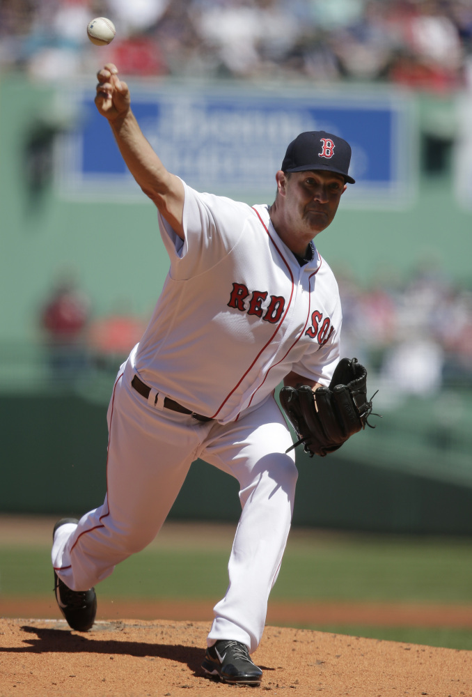 Boston's Steven Wright delivers a pitch against the Toronto Blue Jays in the first inning Sunday at Fenway Park in Boston.