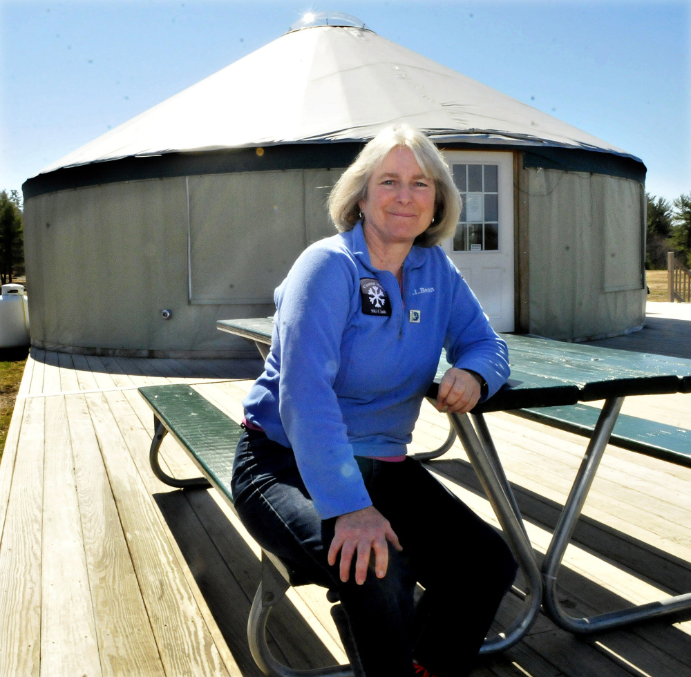 Caroline Mathes sits outside the welcome yurt at Quarry Road Recreation Area in Waterville, which has been named the Community Service Project of the Year by the Mid-Maine Chamber of Commerce.