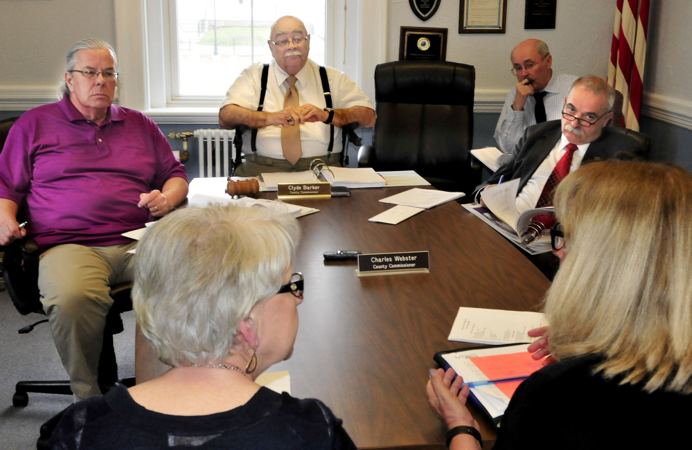Franklin County Commissioners, Gary McGrane, left, Clyde Barker, at the head of the table, and Charles Webster, far right, listen to representatives of Seniors Plus, foreground, during a budget meeting Tuesday in Farmington. The commissioners started their budget review Tuesday and plan to continue through Wednesday, then finalize a proposed budget figure.