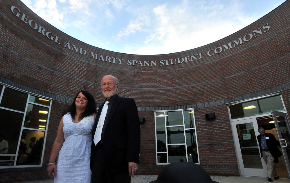 George Spann and his daughter Jennifer stand in June 2012 in front of Thomas College's new student center, named for Spann and his late wife, Marty. Spann, who was the college's president from 1989 to 2012, is scheduled to receive an honorary degree at this year's commencement.