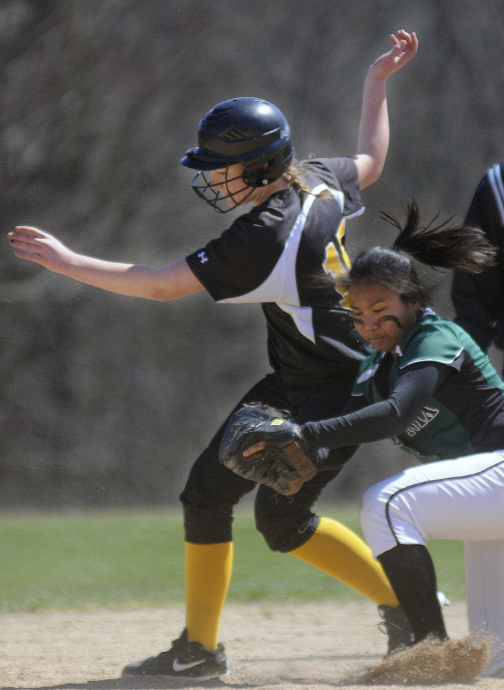 Maranacook's Sierra Weaver, left, collides with Spruce Mountain's Grace Ryan at second base during a softball game Wednesday in Readfield.