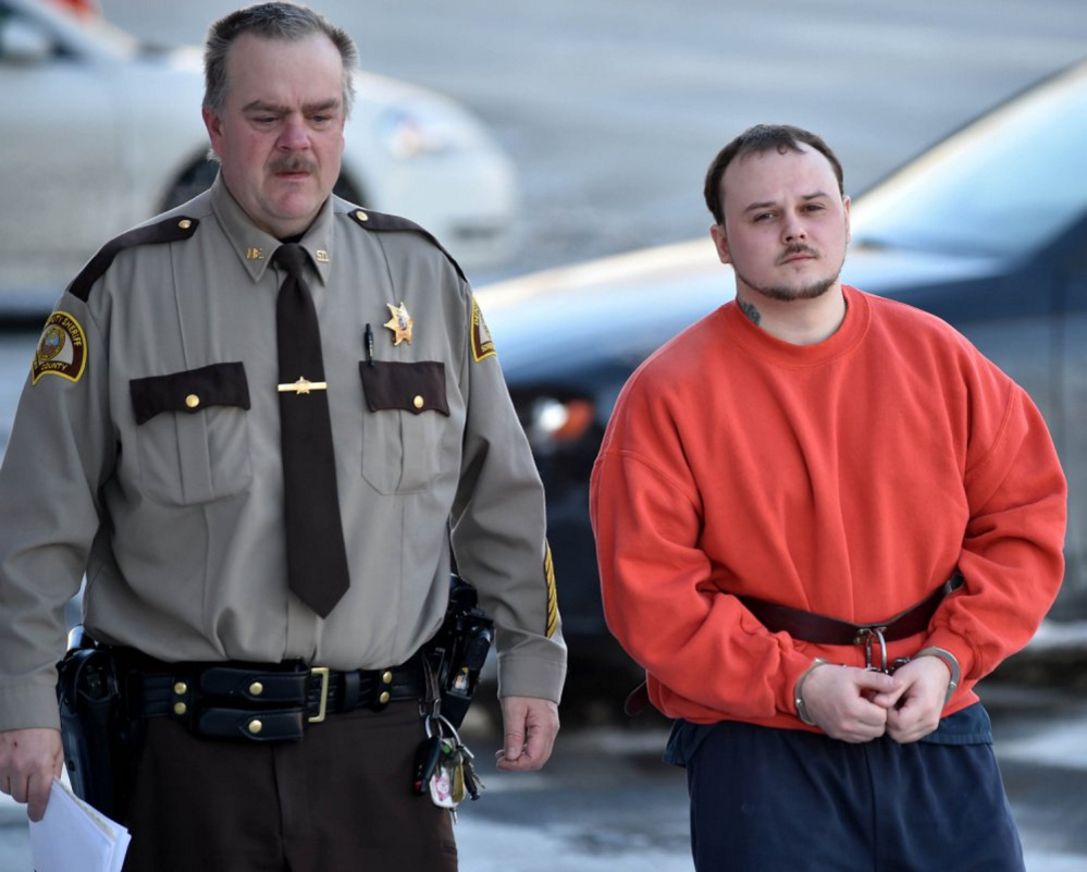 Jason Cote is escorted in February into Somerset County Superior Court in Skowhegan for sentencing. Cote is appealing his 45-year sentence, but his lawyers have filed a motion to withdraw from the case.