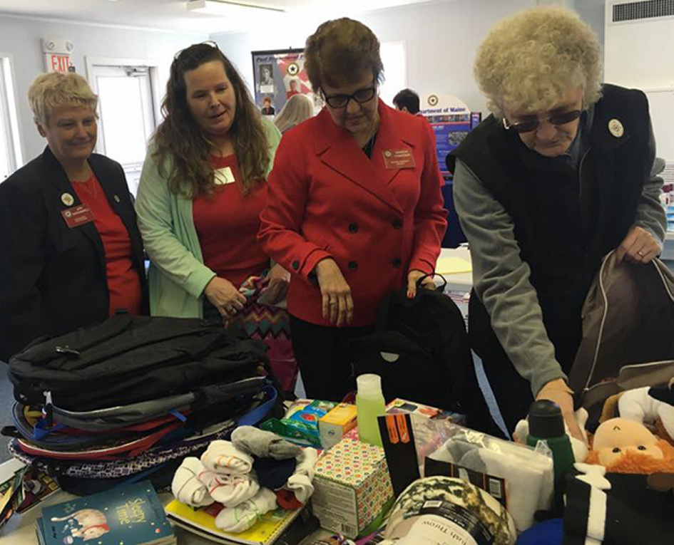 American Legion Auxiliary, Department of Maine hosted National President Sharon Conatser April 8-9 during a stopover in her year-long nationwide tour to call on community members. National President Sharon Conatser, second from right, helped members of the Maine American Legion Auxiliary pack 64 backpacks for the Maine Foster Kids program. From left are Past National Chaplain Jeri Greenwell, of Bethel; State Children and Youth Chairwoman Virginia Chaput, of Bath; Conatser, and Athens Auxiliary Unit 192 President Linda Doiron.