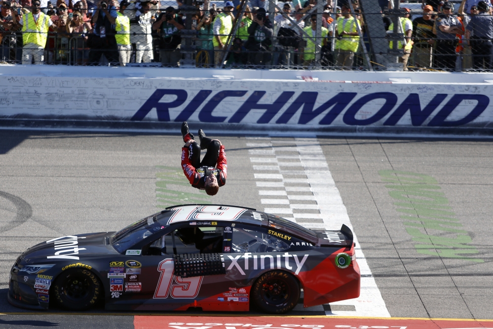 Carl Edwards does a back flip off his car after winning the Sprint Cup race at Richmond International Raceway on Sunday in Richmond, Virginia.