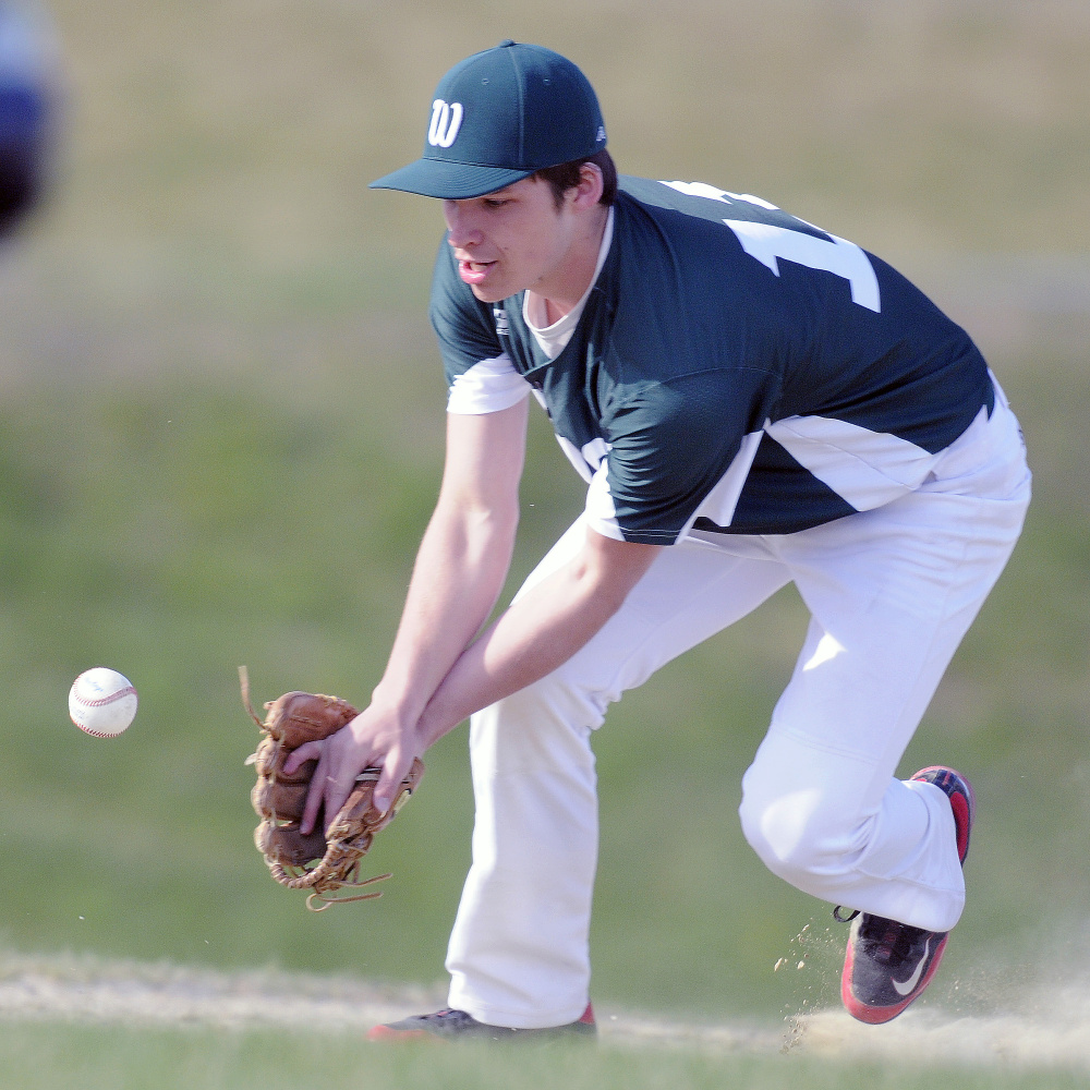 Winthrop's Bennett Brooks fields a grounder during a Mountain Valley Conference game Monday afternoon against rival Monmouth in Winthrop.