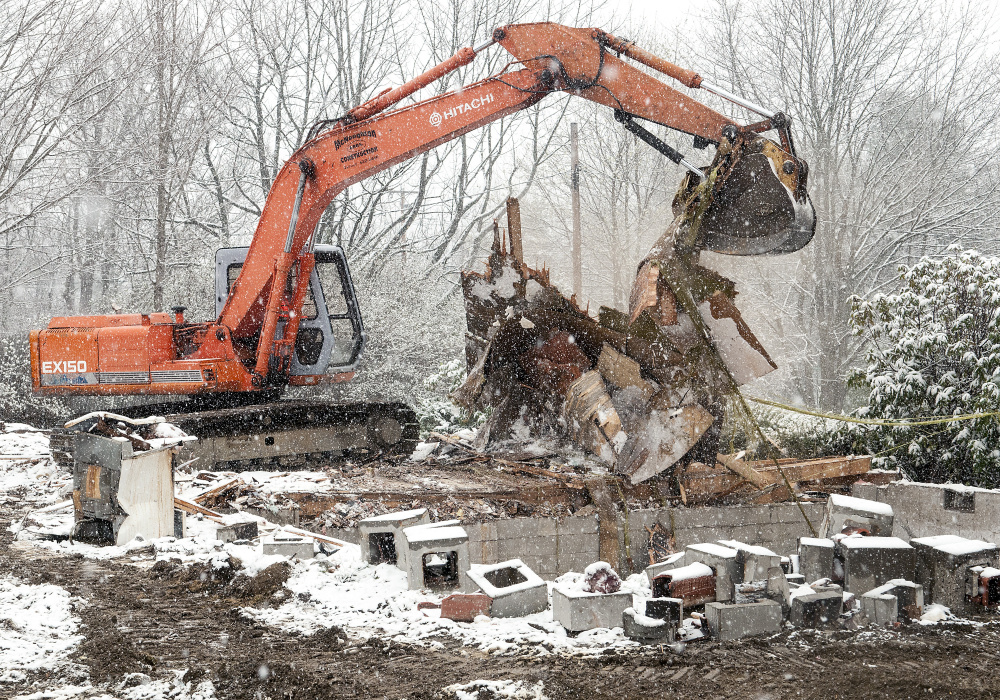 McNaughton Brothers Construction workers demolish the former Janelle's Family Restaurant in Gardiner on Tuesday. Families Matter Inc. plans to build a 3,100-square-foot, single-story office building there.