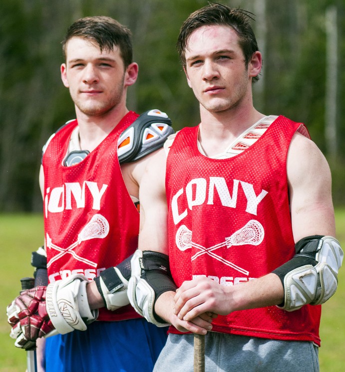 Twin brothers Tyler Sproul, left, and Bret Sproul pose during lacrosse practice Tuesday at Cony High School in Augusta.