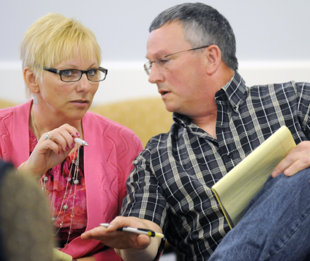 Benton residents Sue and Doug Blaisdell discuss testimony Wednesday before a hearing officer at the Maine Public Utility Commission in Hallowell about noise emanating from a Central Maine Power substation in Benton.