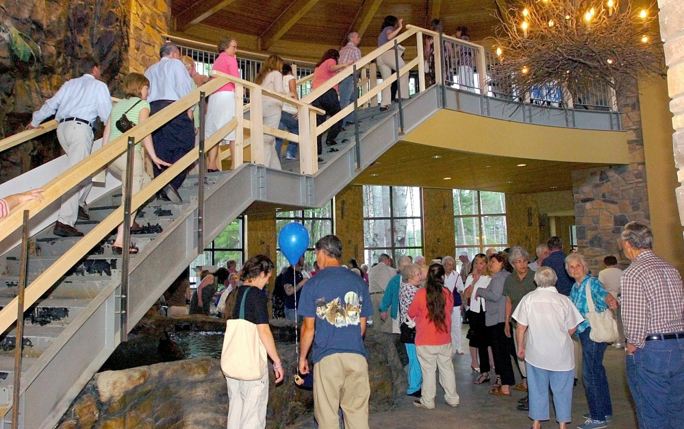 Scores of people tour the new Franklin Health Medical Arts Center in 2008 at Franklin Memorial Hospital in Farmington. The Franklin Community Health Network on Thursday announced a cost-reduction plan that includes layoffs and elimination of vacant jobs after several years of financial losses.