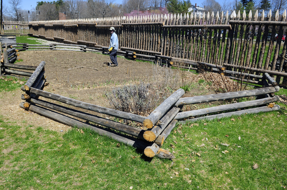 Pete Morrissey talks on Wednesday about what's planted in the garden, which is surrounded by a fence made from old palisade posts, at Old Fort Western in Augusta.