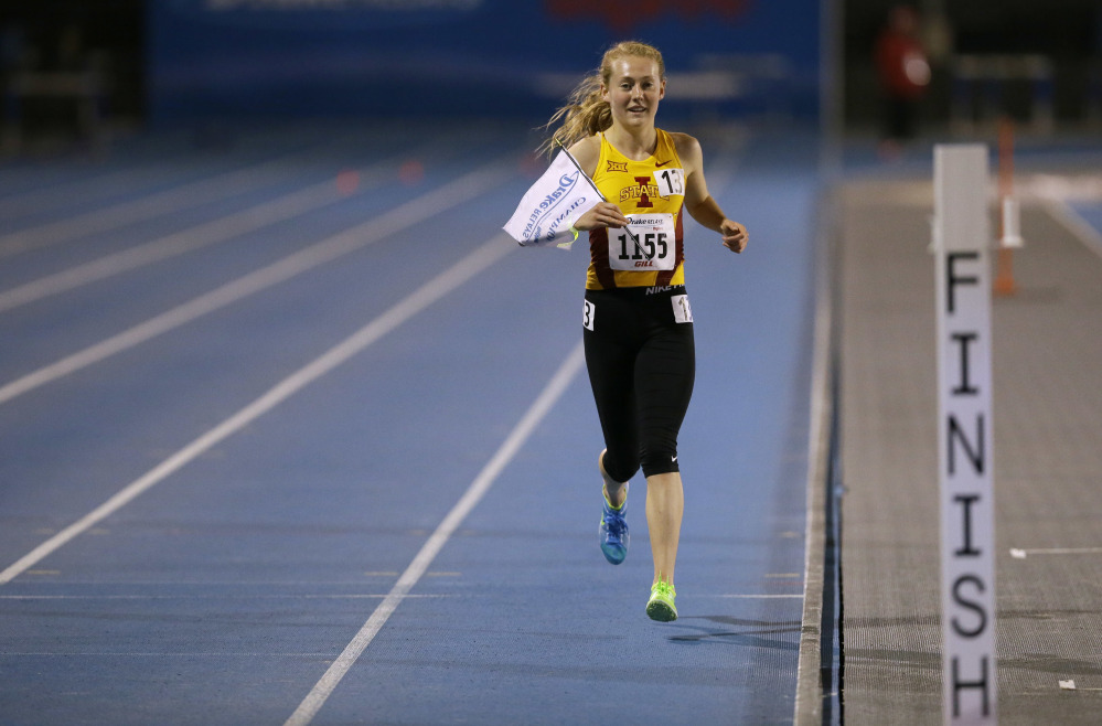Iowa State redshirt sophomore Bethanie Brown takes a victory lap after winning the women's 5000-meter run at the Drake Relays on Thursday in Des Moines, Iowa.