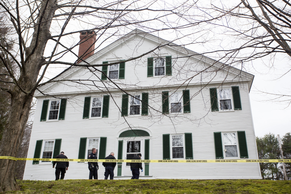 Maine State Police investigators comb the front lawn at 108 Longfellow St. after a Westbrook police officer shot Sean Grossman, 26, who was armed with a handgun, Saturday morning.