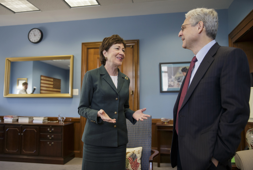 Sen. Susan Collins meets with Judge Merrick Garland, President Obama's choice to replace the late Justice Antonin Scalia on the Supreme Court, Tuesday on Capitol Hill. Collins is one of only two Senate Republicans who say Garland should get a confirmation hearing, against the wishes of Majority Leader Mitch McConnell.