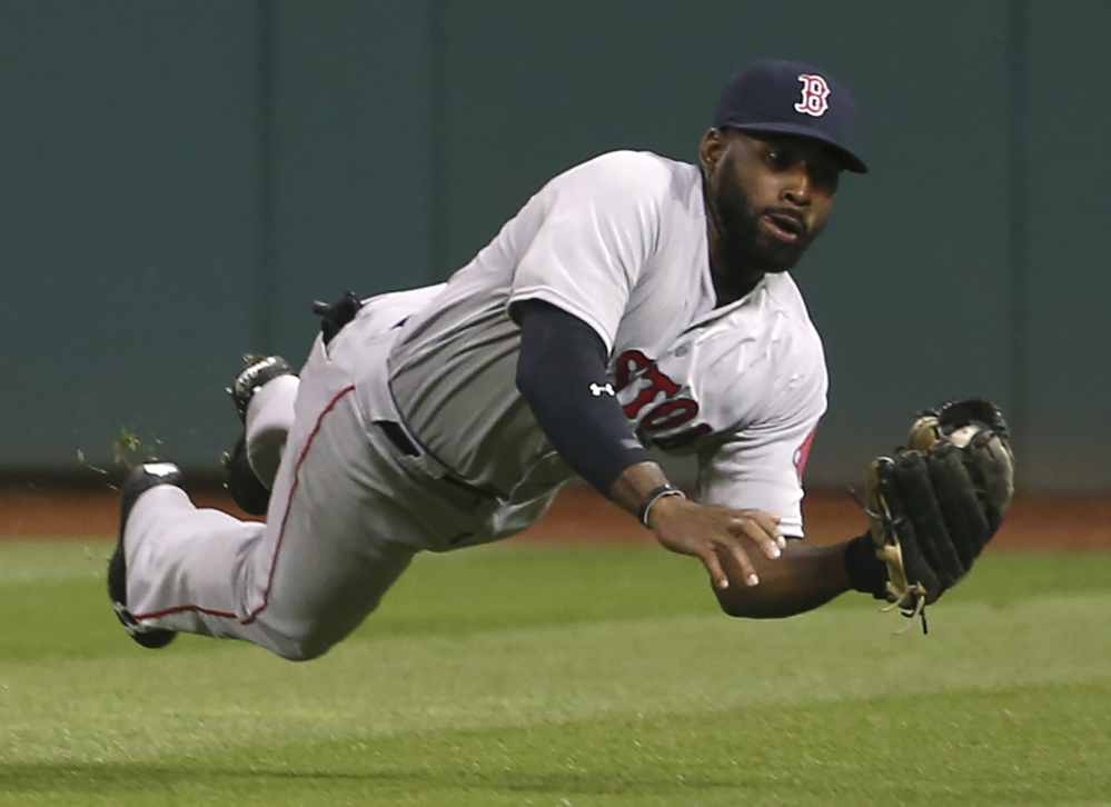 Boston's Jackie Bradley makes a diving catch of a ball hit by Cleveland's Yan Gomes in the seventh inning Wednesday night in Cleveland.