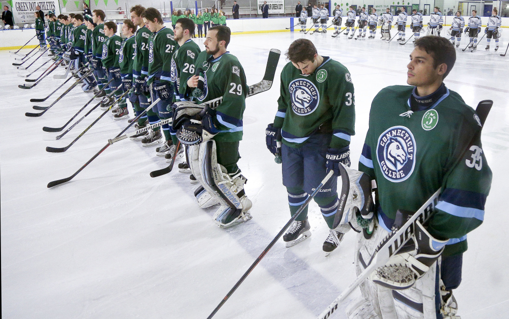 Members of the Connecticut College men's hockey team wear patches to mark the Green Dot hockey game in February in New London, Conn. The U.S. Air Force visited the college in March to get a look at a school that has been using the Green Dot program to stem sexual assault. The Air Force is introducing the program at all its installations.