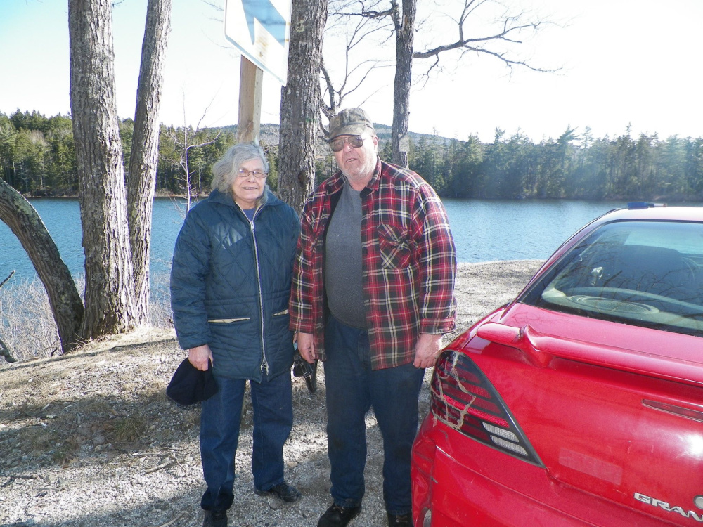 Leonard and Rosemary Wallace came to the aid of a mother and her two children after the car the family was riding in landed in Fox Pond. Maine State Police photo
