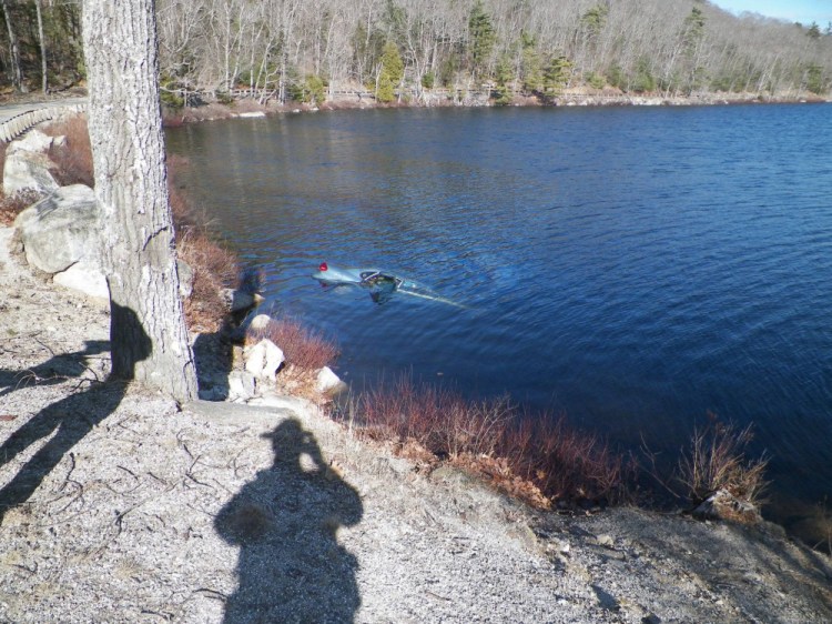 A car sinks in Fox Pond in Hancock County on Saturday.
Maine State Police photo