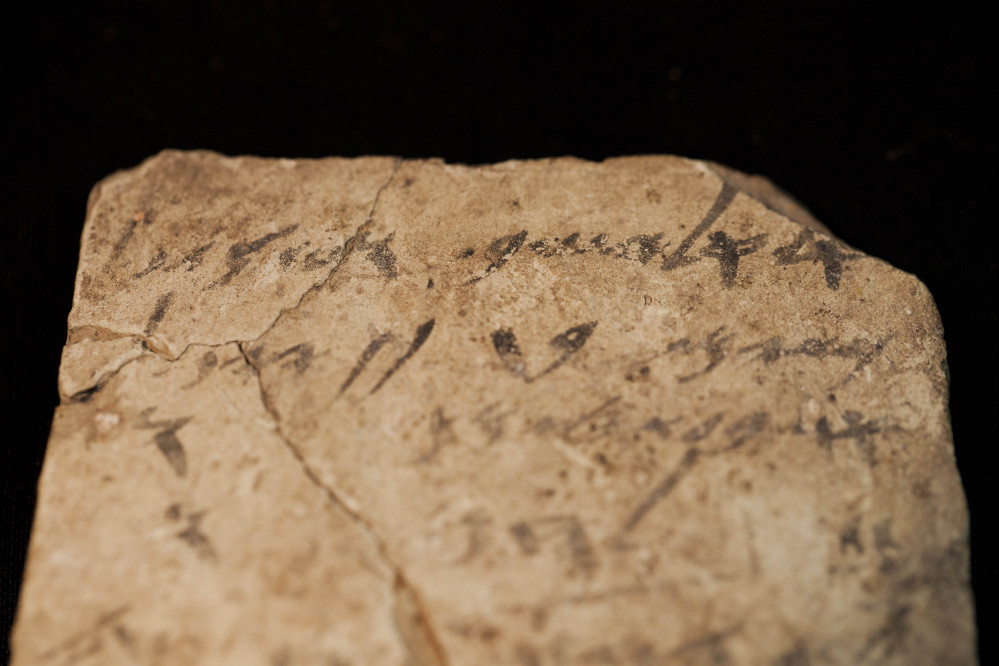 Letters inscribed on pottery, known as ostracons, which were unearthed in an excavation of a fort in Arad, Israel, and dated to about 600 B.C. shortly before Nebuchadnezzar's destruction of Jerusalem, are seen in Israel Museum in Jerusalem Tuesday.