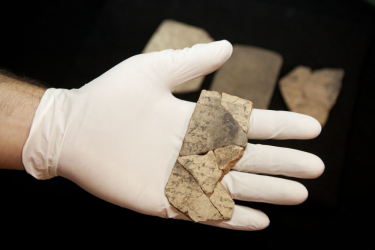Letters inscribed on pottery, known as ostracons, which were unearthed in an excavation of a fort in Arad, Israel, and dated to about 600 B.C. shortly before Nebuchadnezzar's destruction of Jerusalem, are seen in Israel Museum in Jerusalem Tuesday.